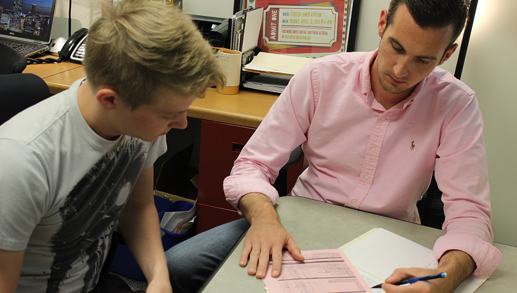 two people reviewing a document