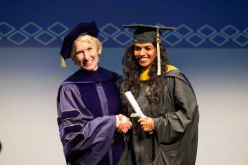 Dean Lozier congratulates a newly minted College of Sciences alum.